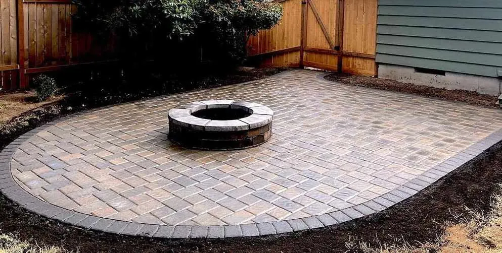 Custom paver patio installation by Torres