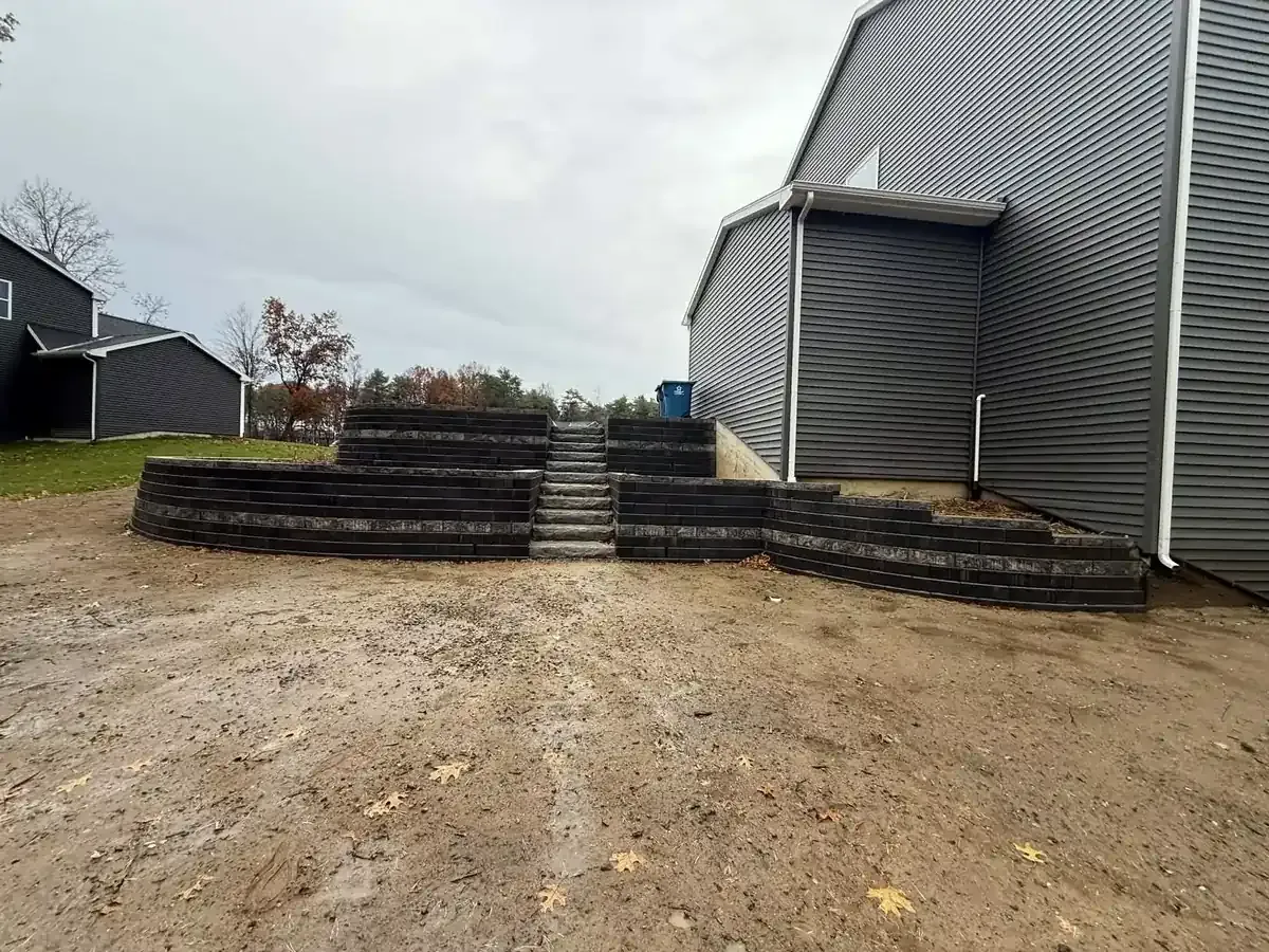 Custom retaining wall installation by Torres