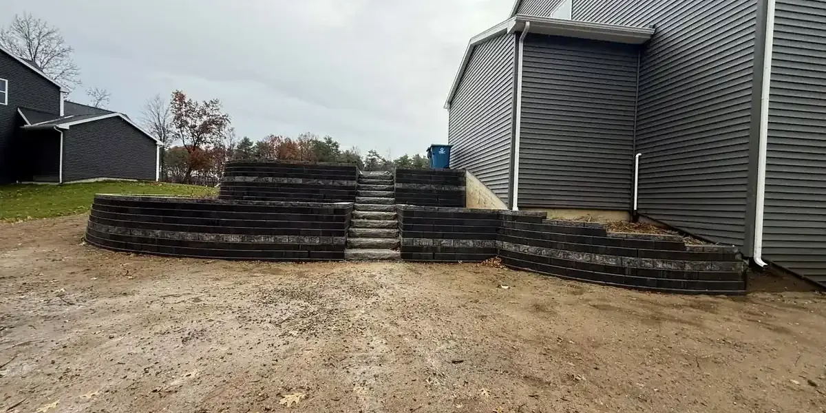 Custom retaining wall installation by Torres